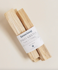 Palo Santo sticks with a label on a light beige background