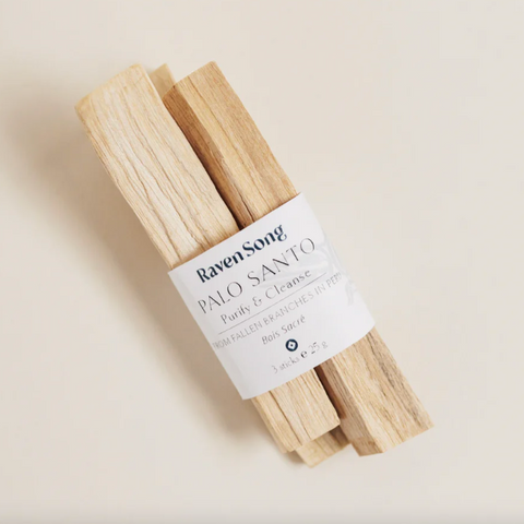 Palo Santo sticks with a label on a light beige background