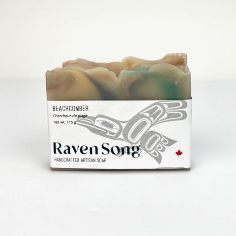 Bar of soap with 'Raven Song' packaging on a white background