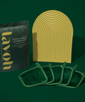 Lavoh makeup removal products including a sponge and cloths on a green background