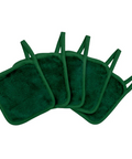Set of green makeup remover pads on a white background