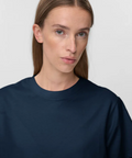 Person wearing a navy blue t-shirt against a white background