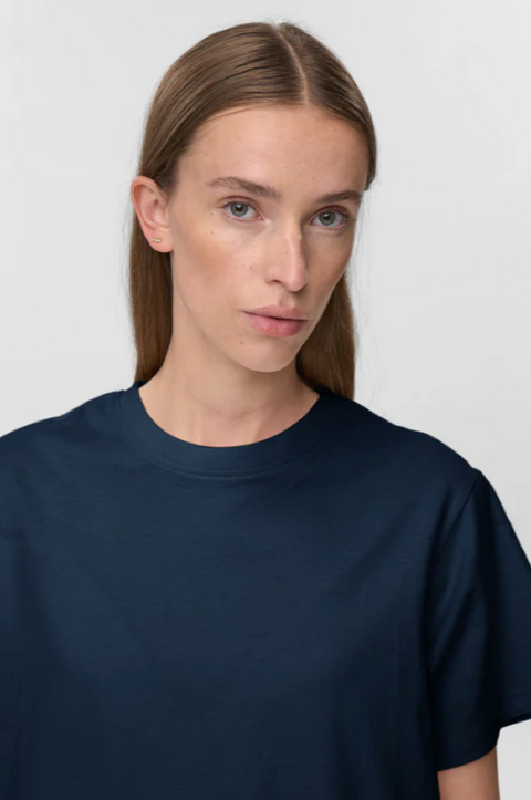 Person wearing a navy blue t-shirt against a white background