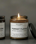Two candles labeled 'Forest Floor' on a website homepage.