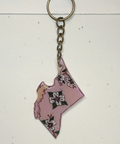 Keychain shaped like a stylized map of British Columbia on a light background
