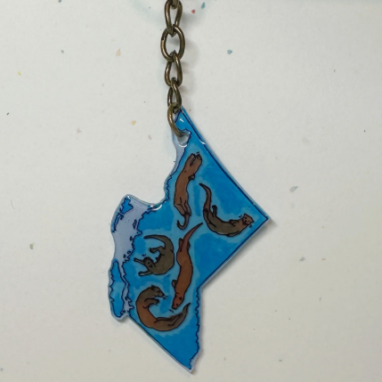 Keychain with blue and brown design on a white background