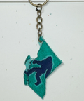 Keychain with teal and navy design on a white background