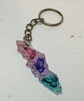 Keychain with butterfly design on a light gray background