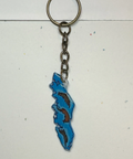 Keychain with a blue and brown design on a light gray background