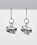 Silver earring with a small round design on a light gray background