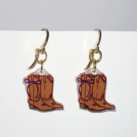 Cowboy boot earrings on a white background