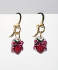 Handmade earrings with strawberry design on a white background