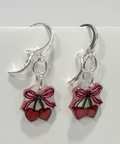 Pair of earrings with berry design on a white background