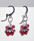 Handmade earrings with cherry designs on a white background