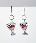 Pair of earrings with glass design and berries on a white background