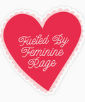 Red heart-shaped sticker with 'Fueled By Feminine Rage' text on a white background