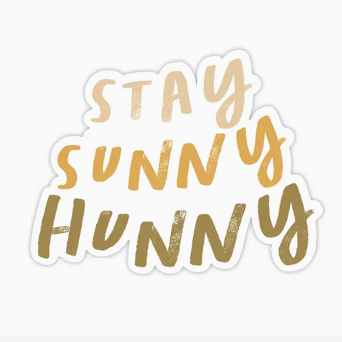 Sticker with 'Stay Sunny Hunny' text in gold on a white background