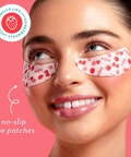 Woman wearing strawberry-themed eye patches with a pink background and branding elements.