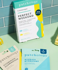 Patchology sheet mask packaging on a light green surface with a teal tiled wall background