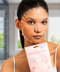 Woman applying a patchology facial mask with a box in the foreground