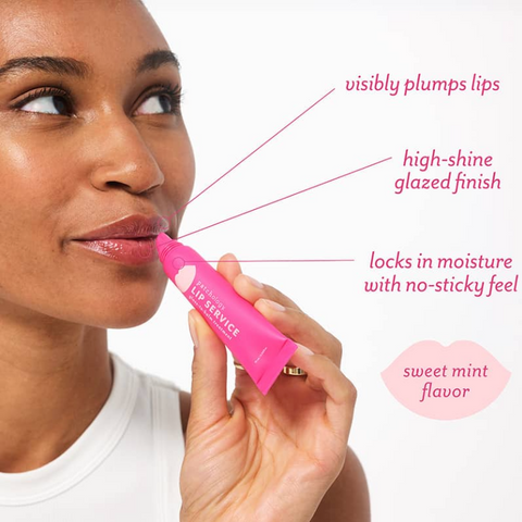 Woman applying pink lip balm with product features highlighted