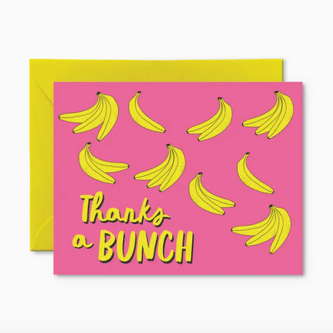 Greeting card with banana pattern and 'Thanks a Bunch' text on pink background with yellow envelope.