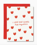 Card with red heart pattern and text 'I LOVE OUR little life together' on a white background
