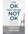 Book cover of 'It's OK That You're Not OK' by Megan Devine with a chair on a gray floor.