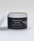 Jar of 'Raven Song New Moon' candle on a white background