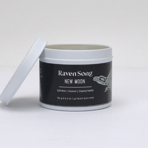 Jar of 'Raven Song New Moon' candle on a white background