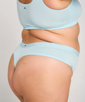 Light blue thong bikini set on a plain background