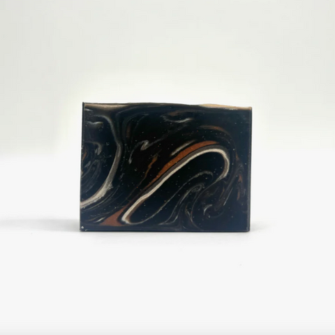 Marbled rectangular object with black, white, and brown colors on a white background