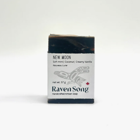 Bar of soap with packaging labeled 'Raven Song' on a white background
