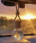 Crystal car hanging ornament with sunset background