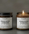 Two candles labeled 'Poolside Cabana' on a gray background