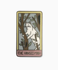 Enamel pin with a cat design and 'The Hanged Man' text on a white background