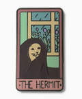 Enamel pin with 'The Hermit' tarot card design on a white background