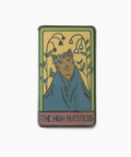 Enamel pin with 'The High Priestess' design featuring a cat-like figure and floral elements on a beige background.