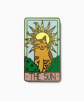 Enamel pin with a cat design under a sun, labeled 'The Sun', on a white background.