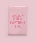Pink square sign with text 'SARCASM WINE & EVERYTHING FINE' on a pink background