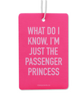 Pink card with white text 'What do I know, I'm just the passenger princess' on a white background