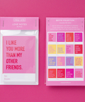 Pink packaging of love notes with colorful text on a pink background