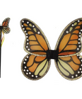 A pair of butterfly costume wings with orange, black, and cream patterned designs, shown alongside a matching wand accessory with yellow and red tassels on a plain white background.