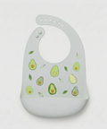 A light gray silicone baby bib with a cute avocado print, featuring a wide chin guard and a flexible neck opening, shown on a plain light gray background.