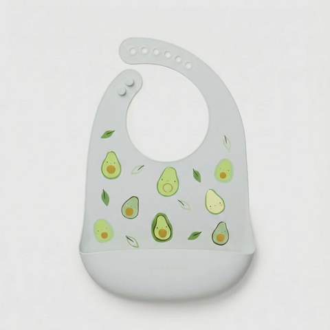 A light gray silicone baby bib with a cute avocado print, featuring a wide chin guard and a flexible neck opening, shown on a plain light gray background.
