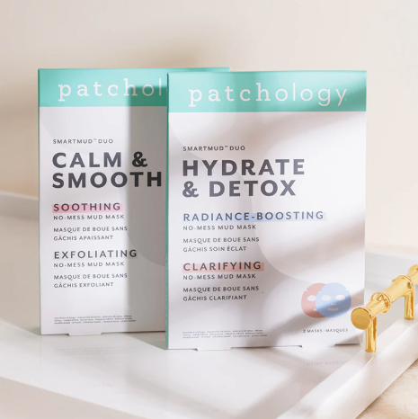 Two boxes of patchology skincare products on a light background