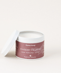 A container of Ravensong Soapberry Ice Cream candle with the lid off, on a white background.