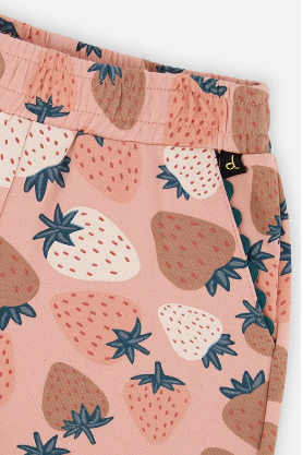 Close-up of a pair of children's pants featuring a pink background with a strawberry print in shades of brown, cream, and blue.