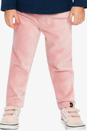 A child wearing light pink corduroy pants, a navy blue long-sleeve top, and light pink sneakers, shown from the waist down against a plain white background.