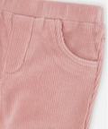 Close-up of a pair of pink corduroy pants showing the waistband, front pocket, and ribbed fabric texture on a light background.